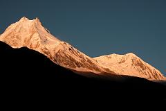 Manaslu 07 04 Manaslu and Manaslu North Sunrise From Syala Manaslu became very much a Japanese mountaineering property in the 1950s, and was climbed in May 1956 by Toshio Imanishi and Gyalzen Norbu Sherpa, members of an expedition led by Yuko Maki, who set their base camp above Sama beside the Manaslu Glacier. Manaslu North (7157m) was first climbed on October 25, 1964 by Fons Driessen and Jan De Lint from Holland, Hubert Schriebl from Austria, and Sherpas Jila Tsering and Nima Tenzing.
